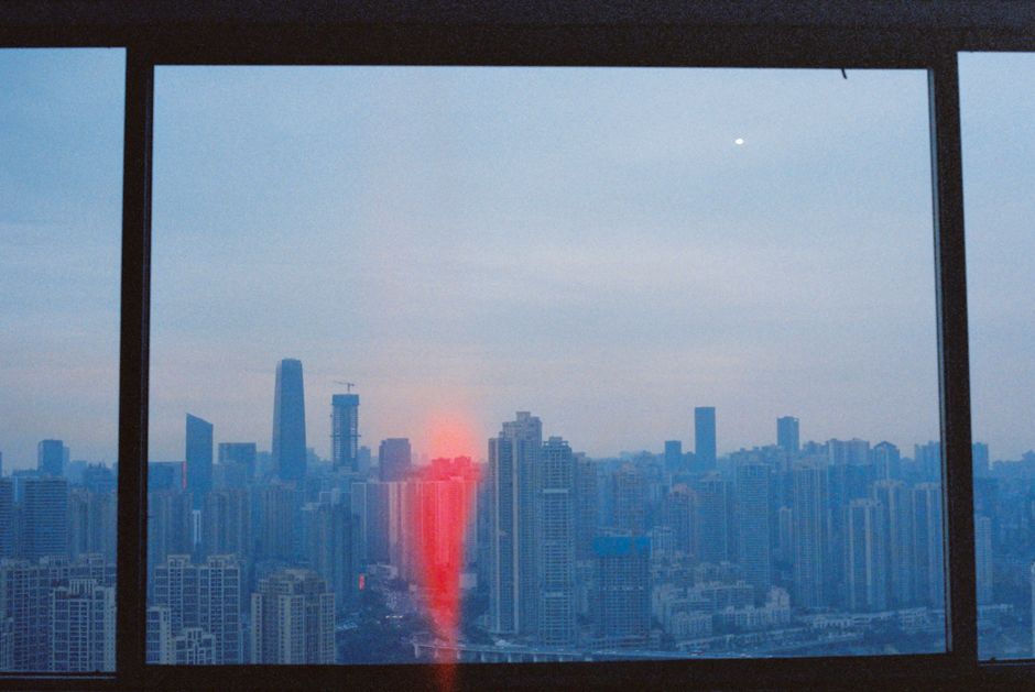 City view from an office window at dusk