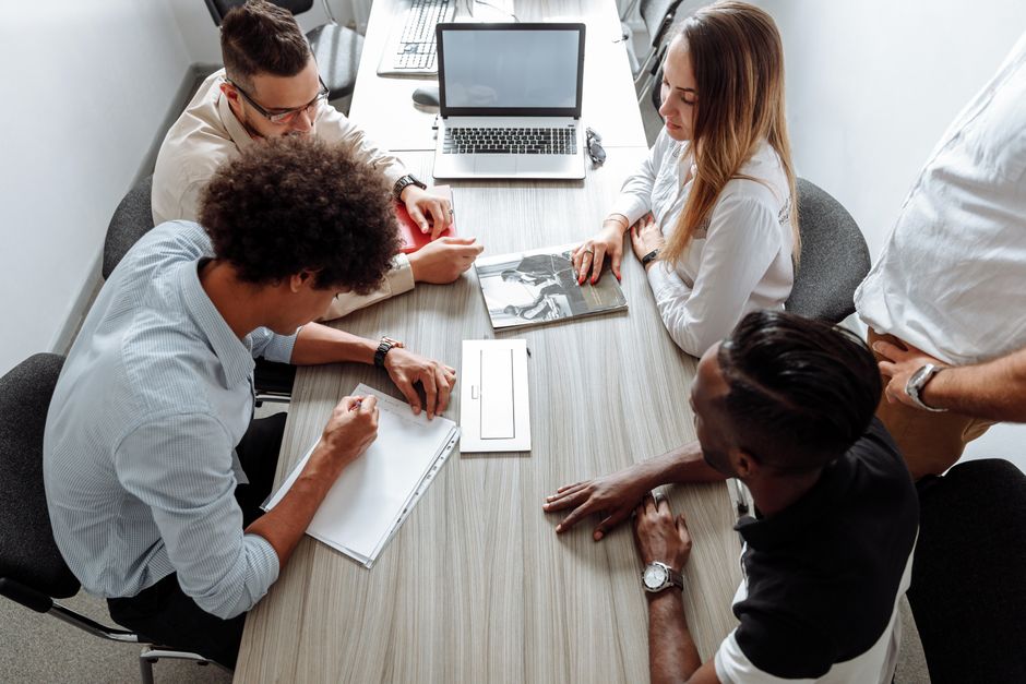Small group in discussion around a table
